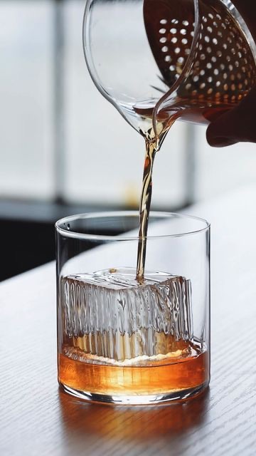 A measure poured over hand-carved ice at the bar